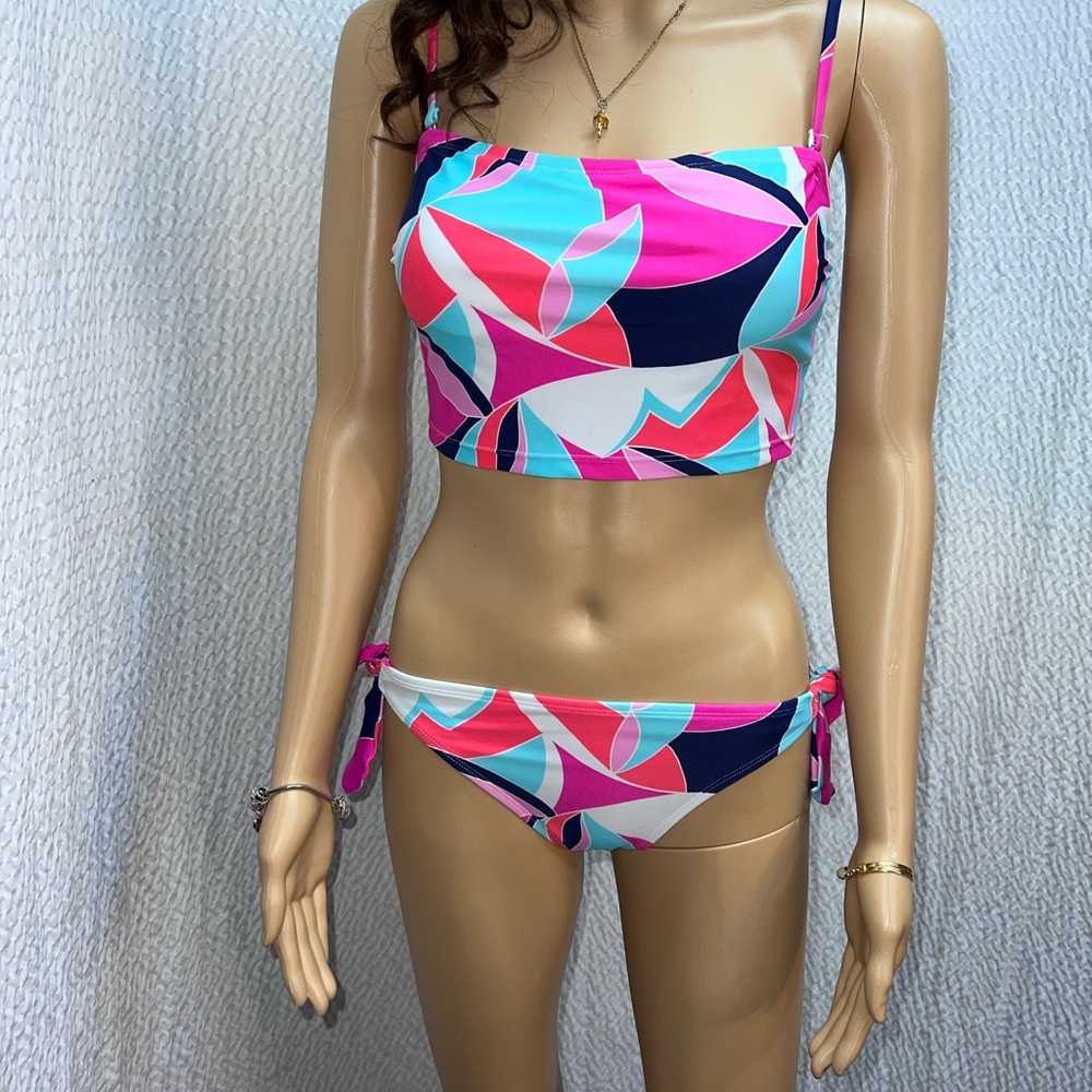 NWOT- ne’er worn Women’s brightly colored swimsuit nwot